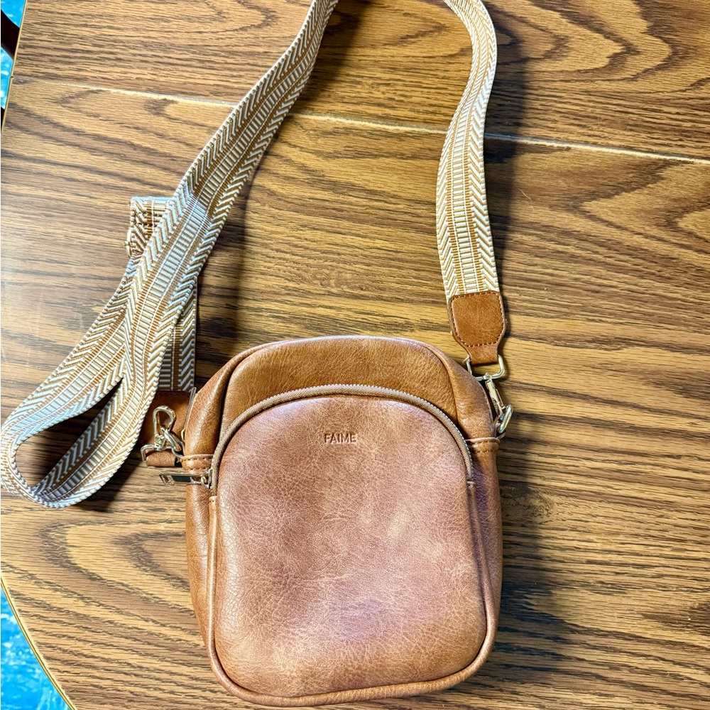 Brown Crossbody Bag with Adjustable Woven Strap and Metal Hardware